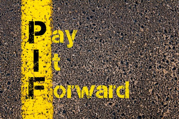 What does “paying it forward” mean?